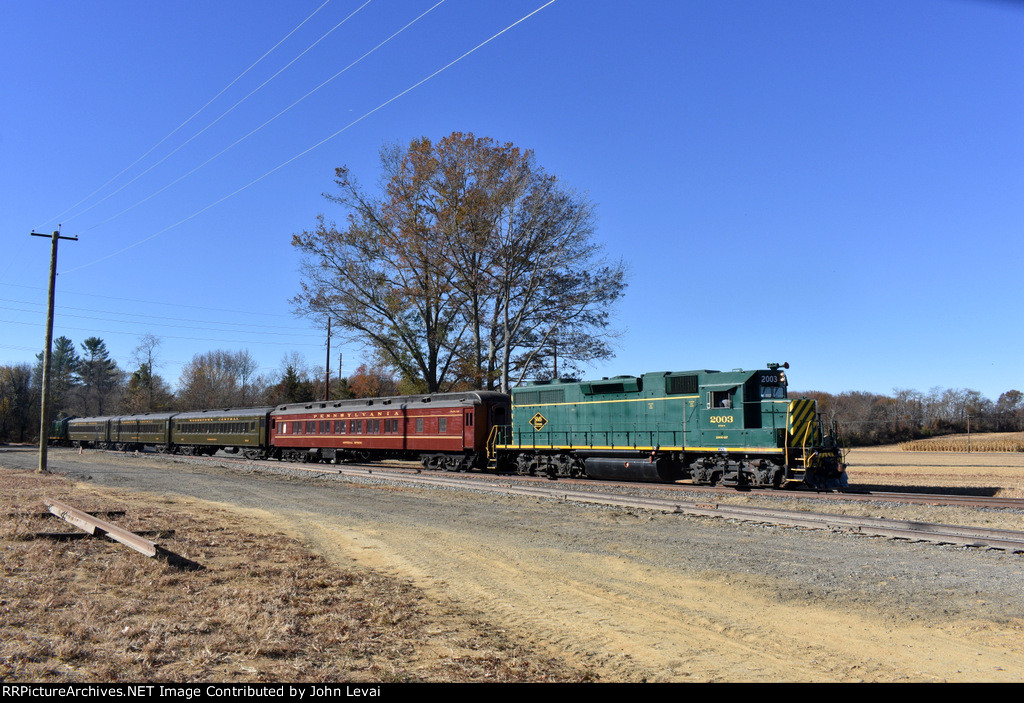 The 2003 leads the passenger special back across E Lake Rd xing in Woodstown. This spot is a few tenths of a mile south of the South Woodstown Station.